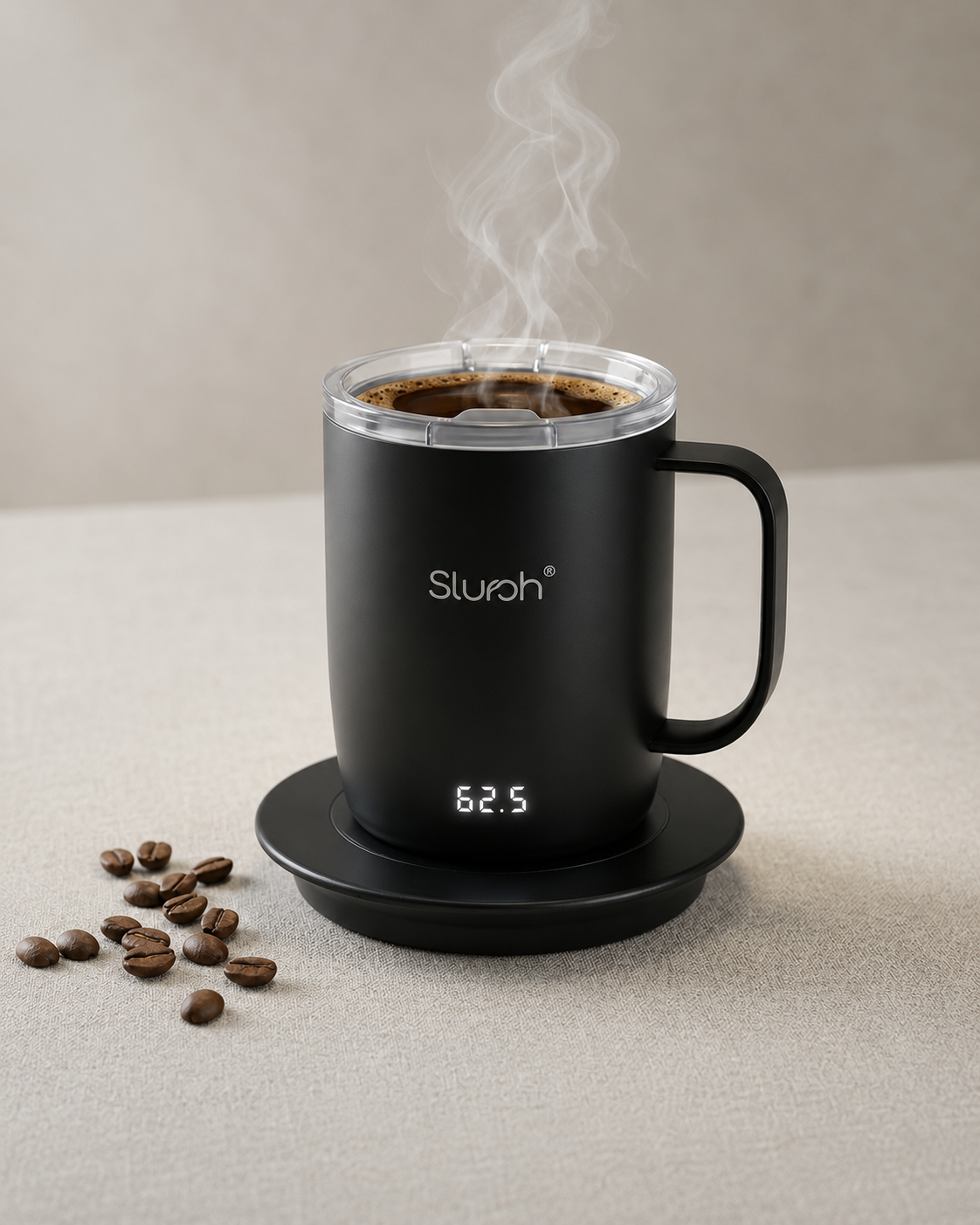 The Slursh Smart Mug steaming on its warming base beside fresh coffee beans
