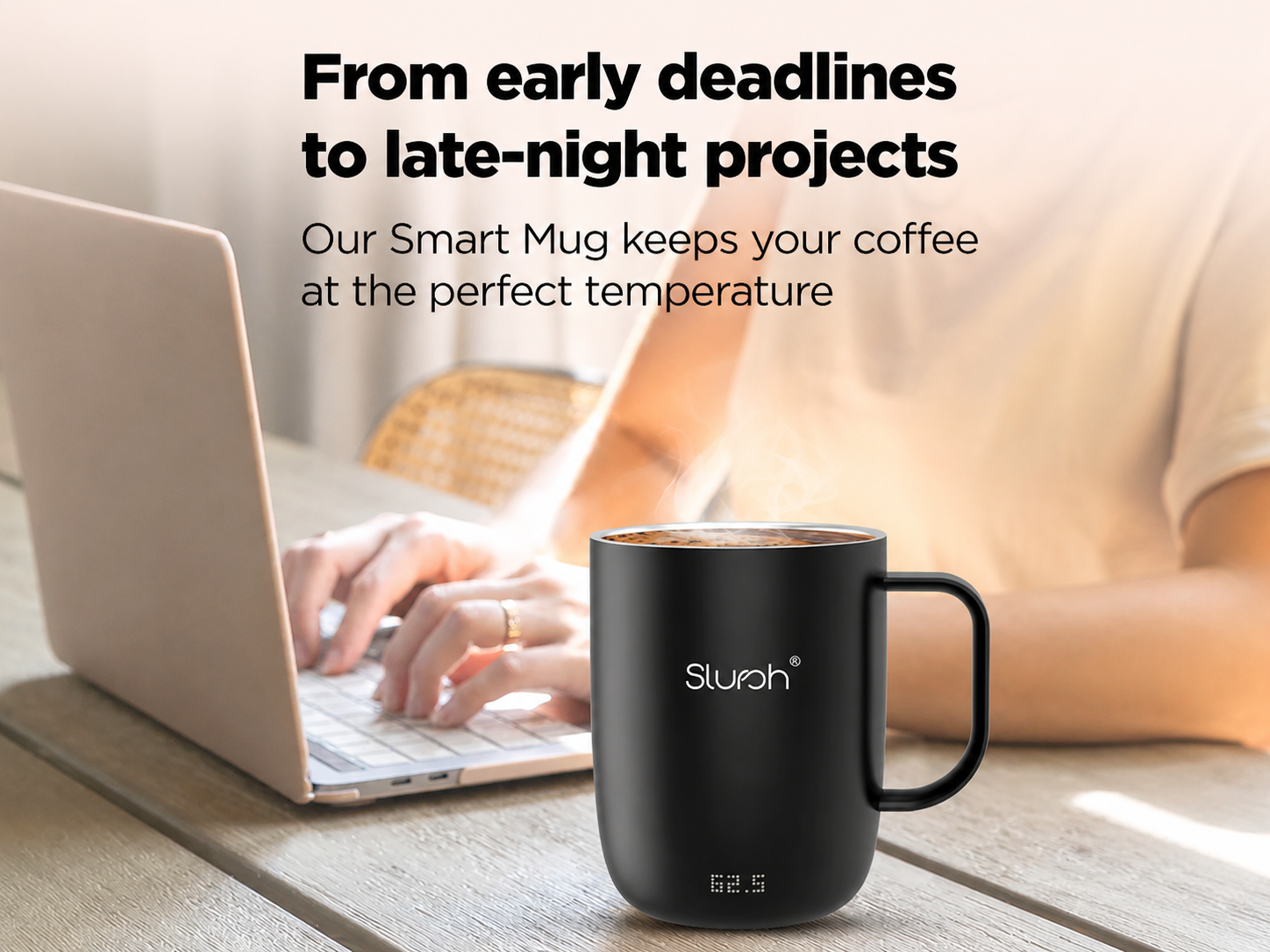 A workspace with a Slursh Smart Mug sitting next to a laptop